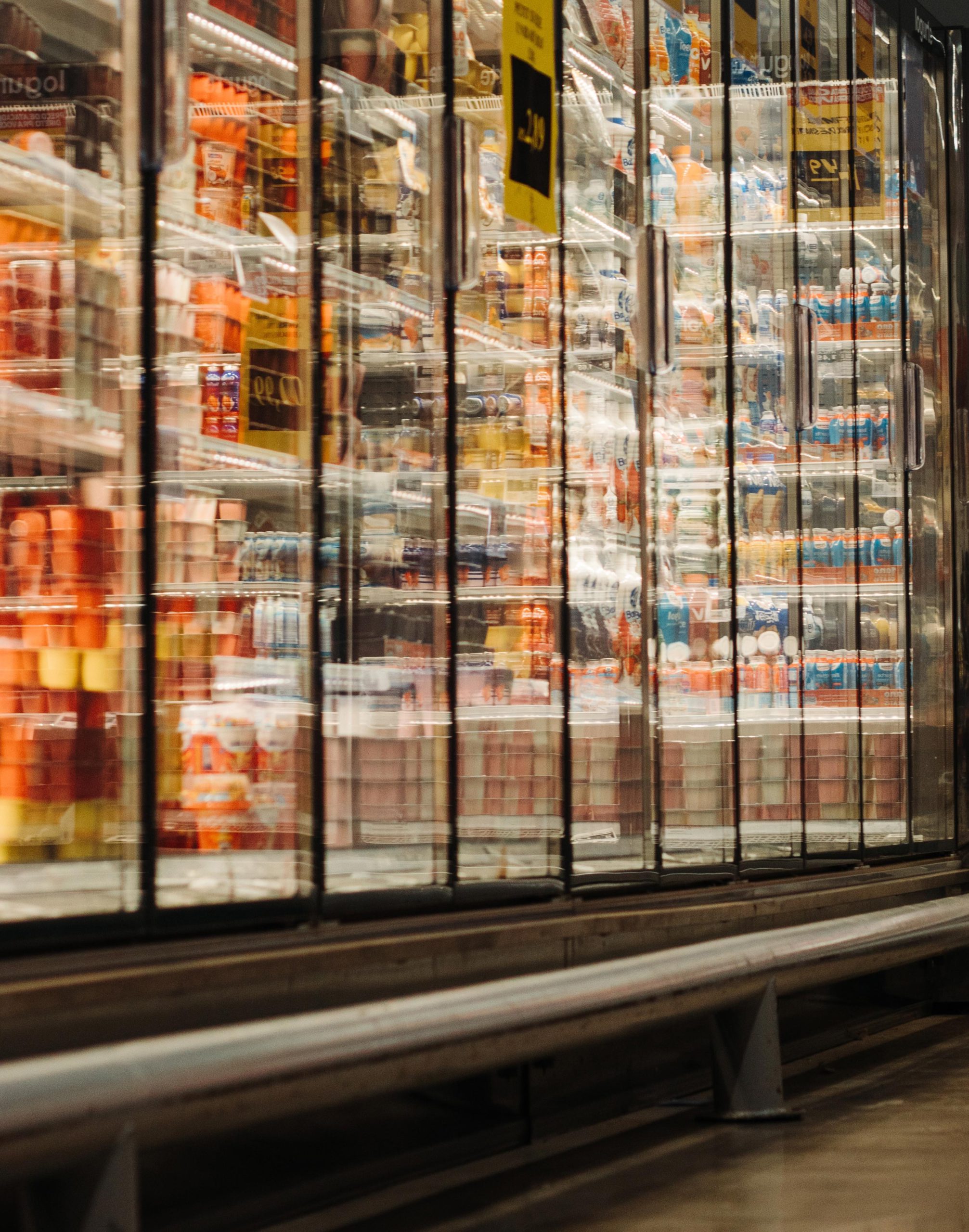 A grocery aisle of the frozen food section.